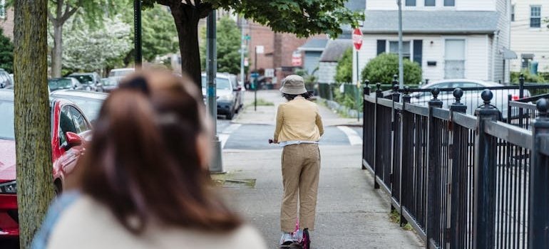 A woman walking on the street after moving into Co-op City