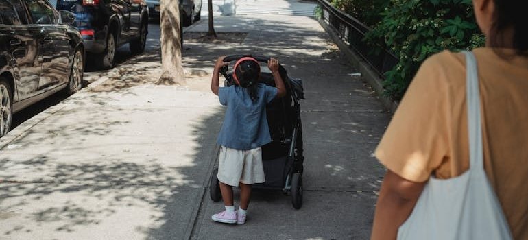A mother with the kid on the street