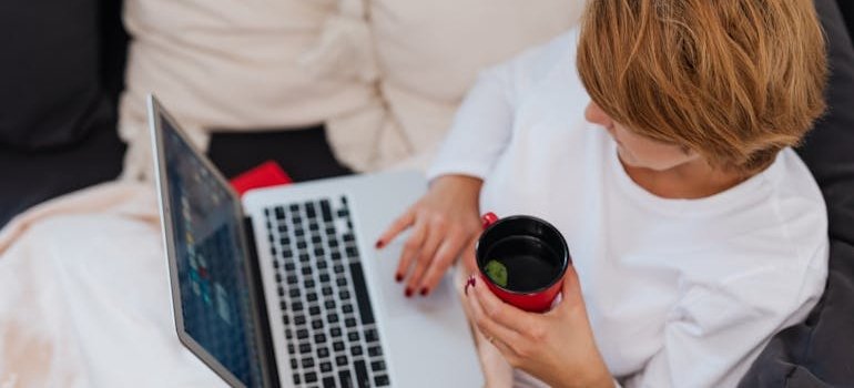 A woman working from home in one of the Manhattan neighborhoods for remote workers
