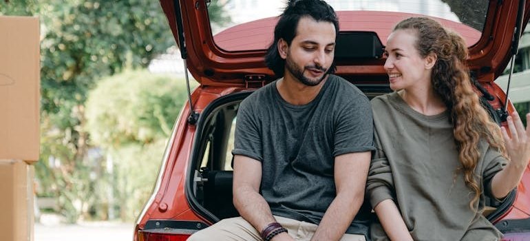 A couple talking about what to do with your car when moving