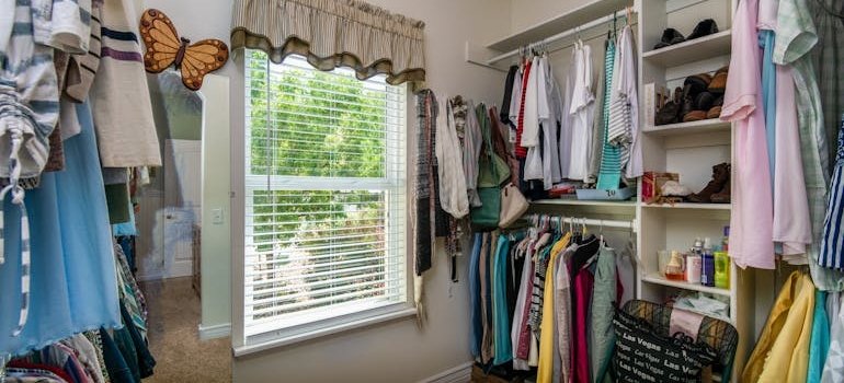 An overfilled closet as one of the signs your Manhattan apartment needs extra storage