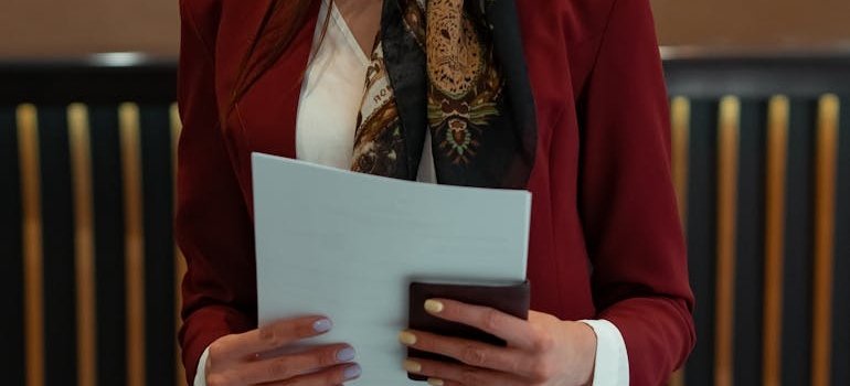 A woman holding documents