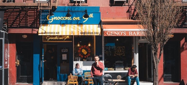 A person in front of the restaurant