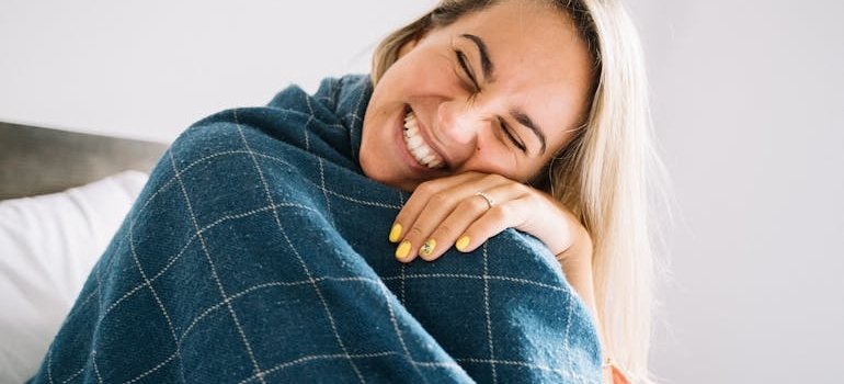 A happy person who is using storage to separate work and home life