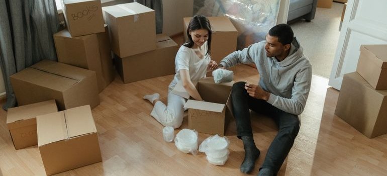A couple packing for relocation