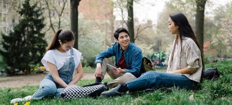 Students in the park sharing storage tips for Fordham University students