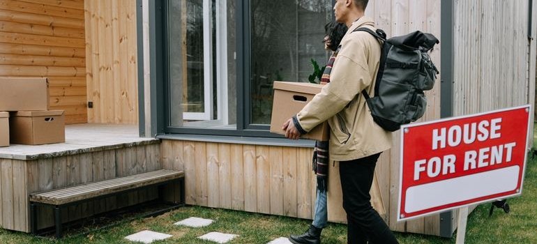 A couple moving and talking about the differences between living in Manhattan and the Bronx