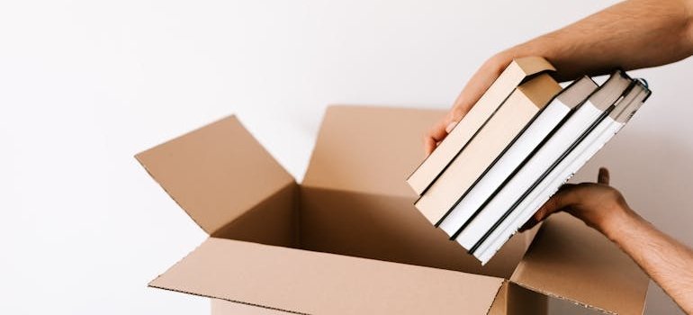 A person packing books