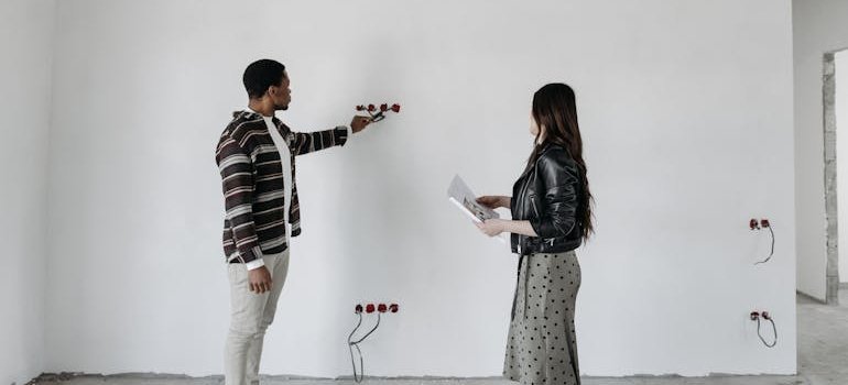 Two people talking about apartment renovations in Tribeca