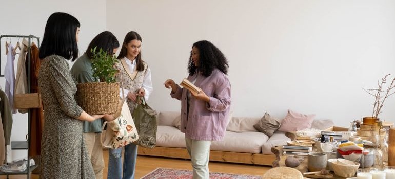 Women in the room talking about questions to ask before renting a storage unit