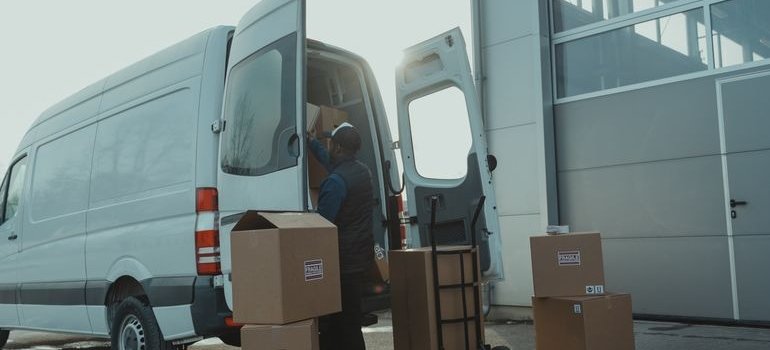 A person unloading items and thinking about climate controlled storage vs standard storage