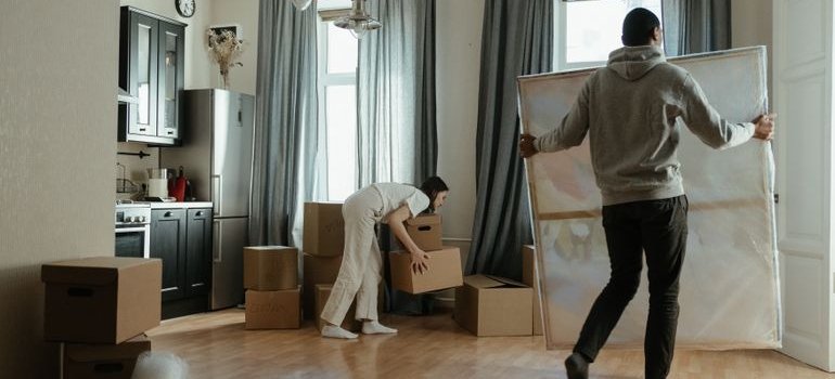 A couple unpacking boxes
