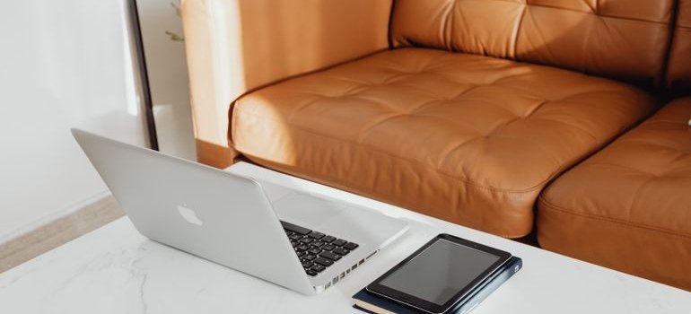 Laptop next to the sofa
