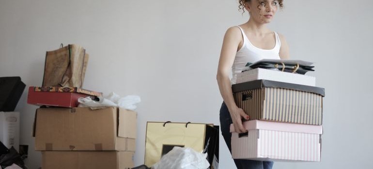 A woman preparing belongings for storage Longwood NY